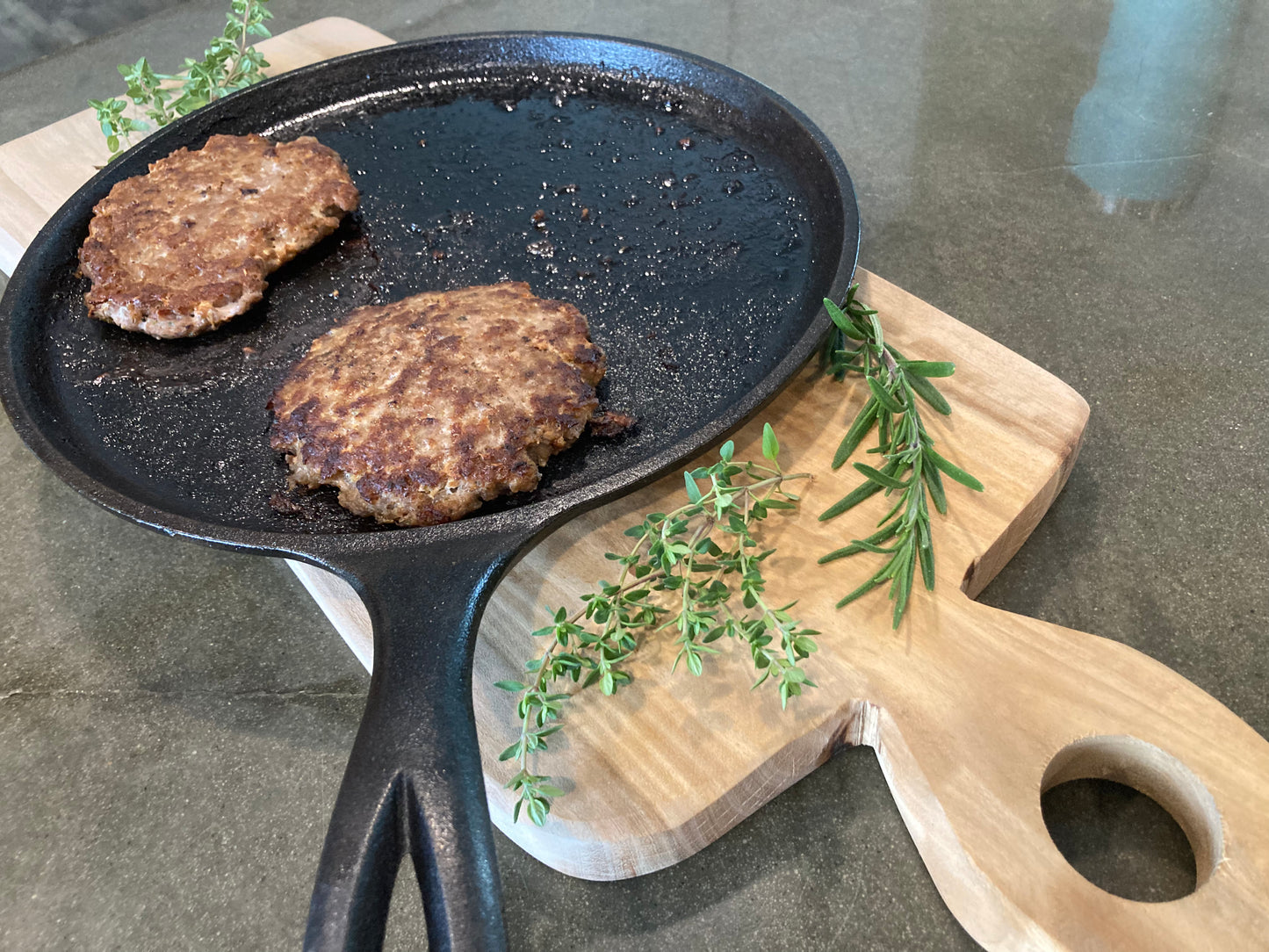 Souvlaki all pork burgers. cooked on a cast-iron frying pan. 